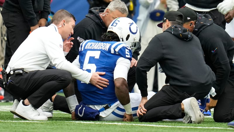 Indianapolis Colts quarterback Anthony Richardson (5) is checked out by medical staff on the...