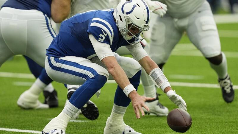 Indianapolis Colts quarterback Matt Ryan (2) recovers his own fumble during the second half of...
