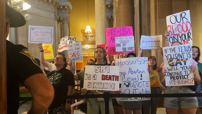 Abortion-rights protesters fill Indiana Statehouse corridors and cheer outside legislative...
