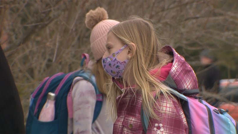 FILE - Students in masks