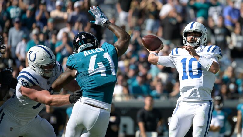 Indianapolis Colts quarterback Gardner Minshew (10) looks to pass under pressure from...