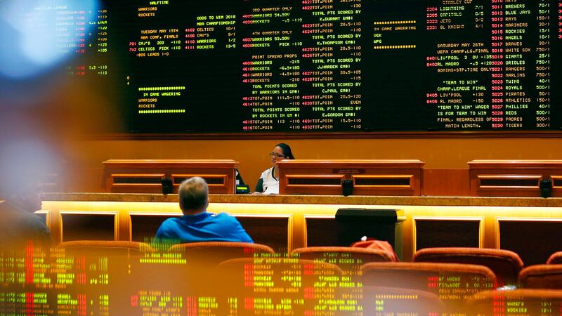 In this Monday, May 14, 2018 photo, betting odds are displayed on a board in a sports book in...