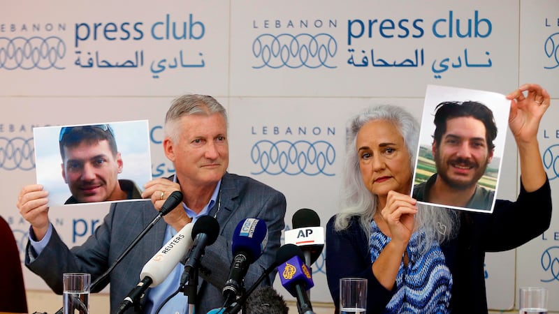FILE - Marc and Debra Tice, the parents of Austin Tice, an American journalist who has been...